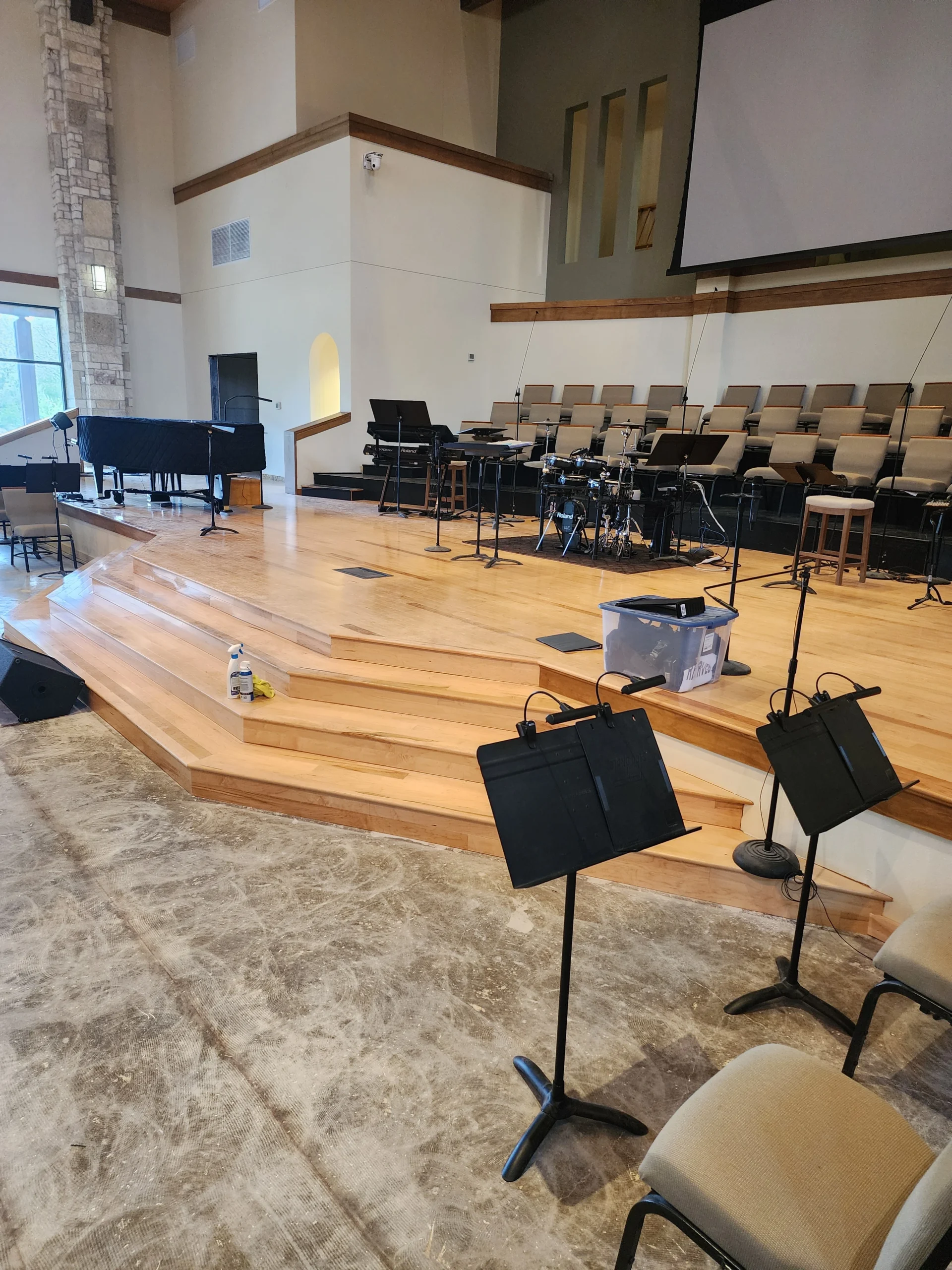A photo of A Prefinished Engineered Hardwood Floor Installed On A Stage In San Marcos, Tx by The Habitat Heroes