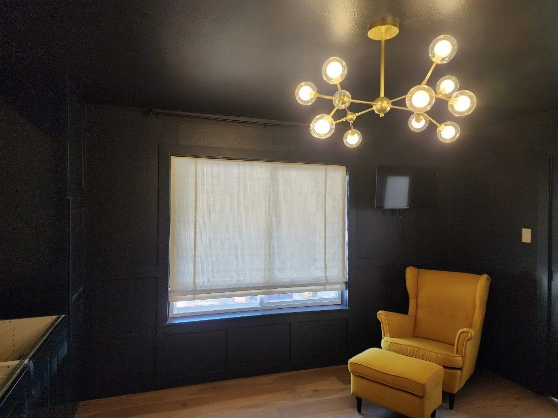 Accent wall installed and dark blue color drench painting by Habitat Heroes in South Austin