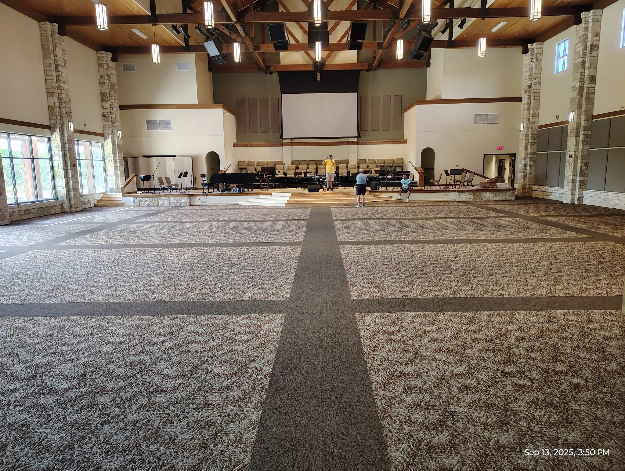 Commercial carpet installed in a church sanctuary by Habitat Heroes in 2025